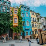 A lively street featuring colorful historic buildings, perfect for travel inspiration.