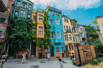 A lively street featuring colorful historic buildings, perfect for travel inspiration.